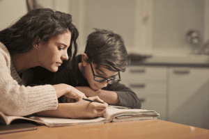 It’s Time to Fight the Teen Sleep Epidemic!, image of young mom with teenager studying and looking tired