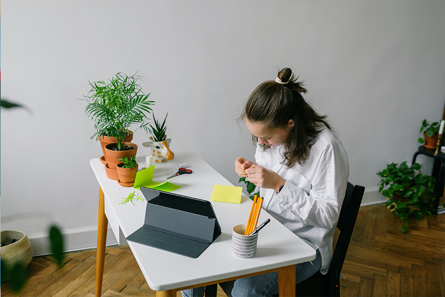 Parenting a Child with ADHD: How to Find Harmony in Your Home in the Summertime, image of a student working at the desk with flashcards