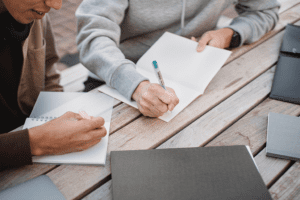 College Prep 2023: Tips for Application Essay Success, image of two teens writing their college essays