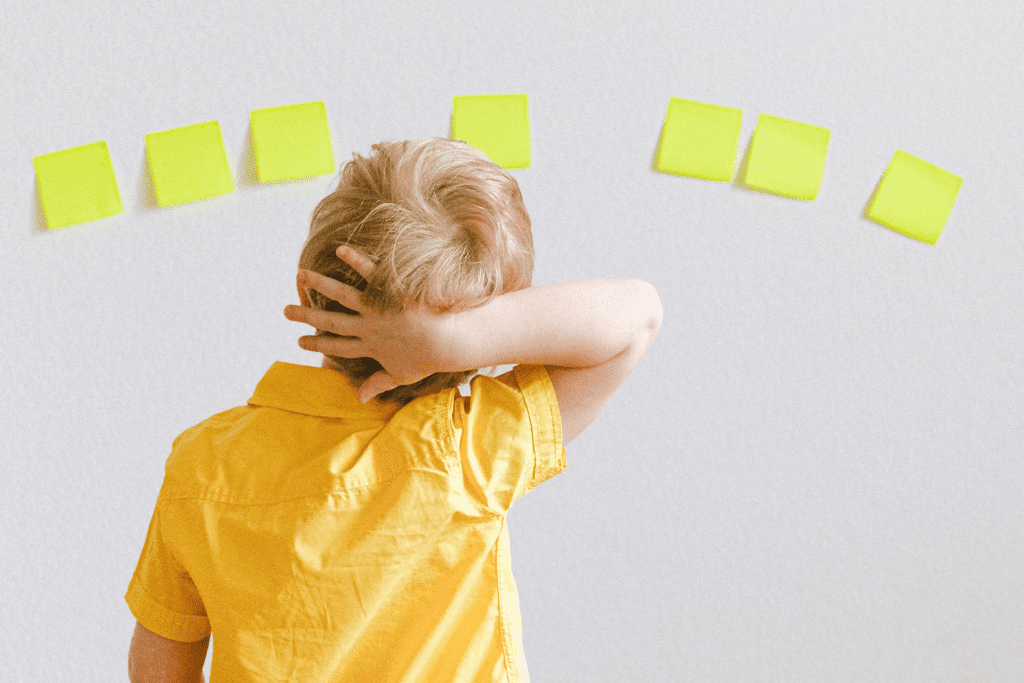 Executive Function: The Silent Force Behind Every Child's Development, image of a child thinking, wall of blank post-it notes.
