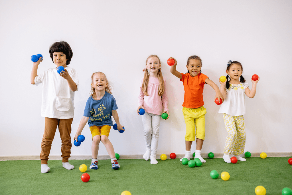Navigating Day-to-Day: How Executive Function Influences Every Choice, image of kids playing with color balls standing next to a wall.