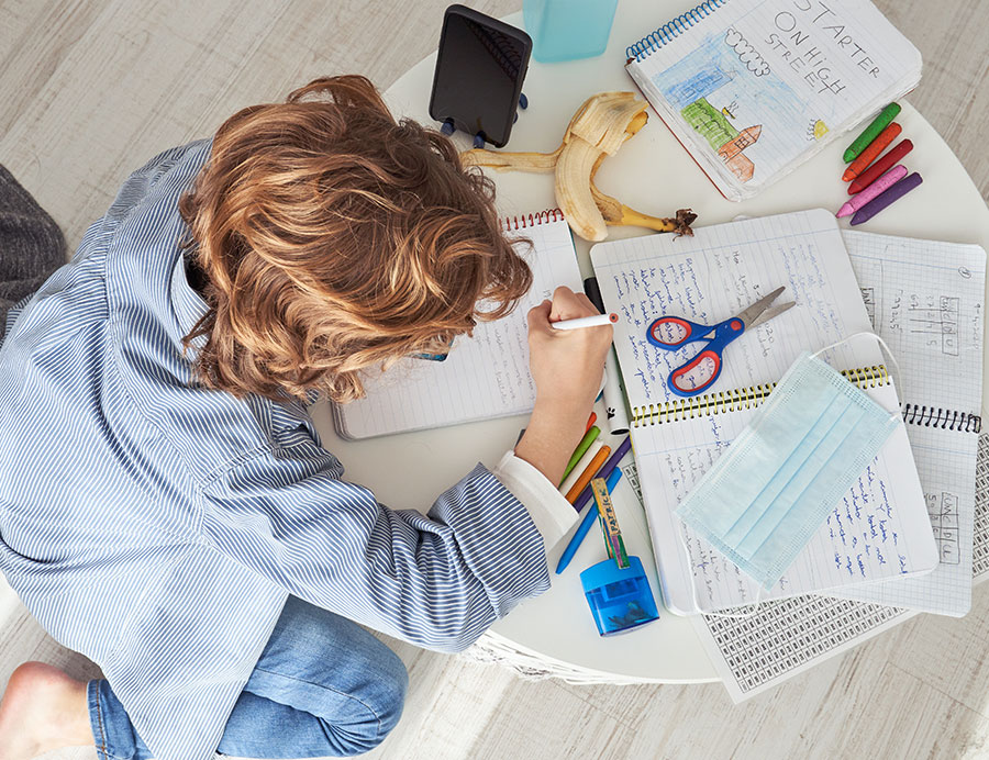 Executive Functioning Support for Students, image of a young student working on homework.