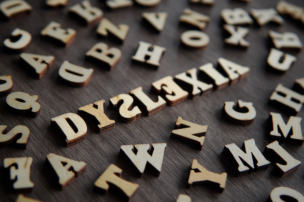 Navigating Dyslexia: A Parent’s Journey, image of tiles spelling out Dyslexia