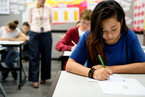 benefits of ap classes, image of student working on test.